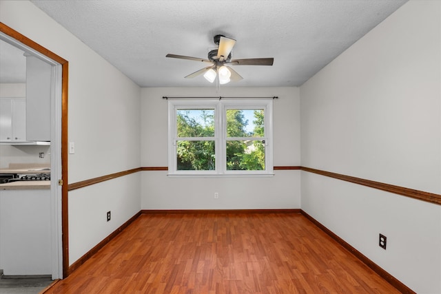 172 Creek View Ct, Martinez, GA 30907 - empty room featuring light wood-style floors, a ceiling fan, and a textured ceiling