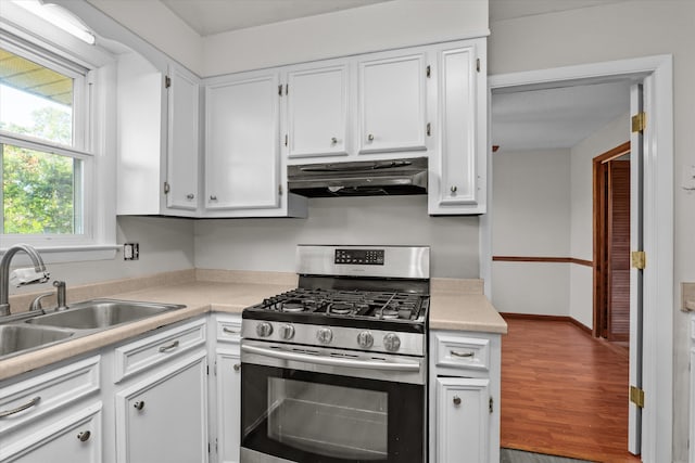 172 Creek View Ct, Martinez, GA 30907 - kitchen featuring stainless steel gas stove, ventilation hood, white cabinets, and light countertops