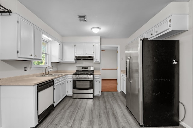 172 Creek View Ct, Martinez, GA 30907 - kitchen featuring appliances with stainless steel finishes, light wood finished floors, white cabinets, and light countertops