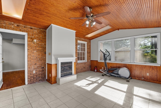 172 Creek View Ct, Martinez, GA 30907 - workout area featuring wooden ceiling, a ceiling fan, wood walls, a wainscoted wall, and a glass covered fireplace