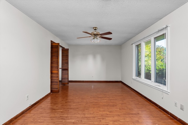 172 Creek View Ct, Martinez, GA 30907 - empty room with a ceiling fan, light wood finished floors, and a textured ceiling