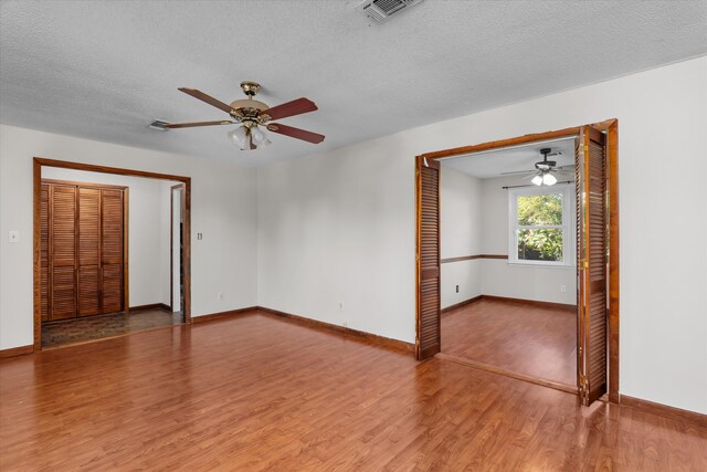 172 Creek View Ct, Martinez, GA 30907 - spare room featuring light wood-style flooring, ceiling fan, and a textured ceiling