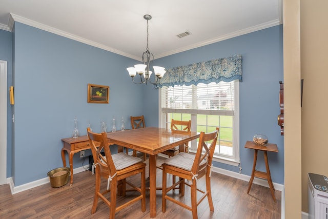 821 Wickham Dr, Graniteville, SC 29829 - dining area with ornamental molding, baseboards, a chandelier, and wood finished floors