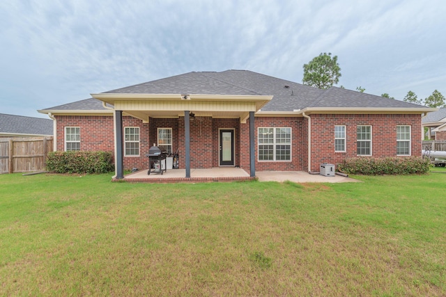821 Wickham Dr, Graniteville, SC 29829 - back of house with a patio area, brick siding, central air condition unit, and a shingled roof