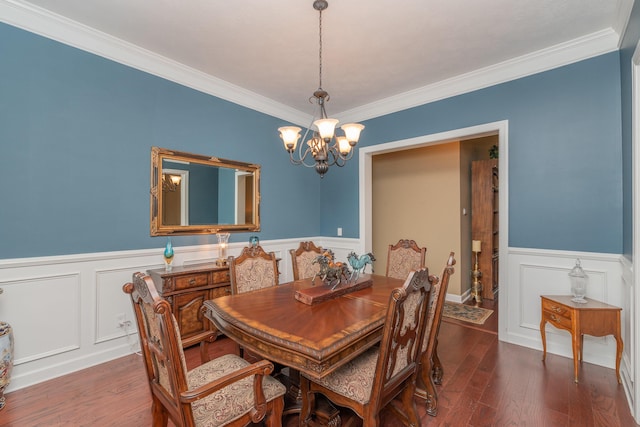 821 Wickham Dr, Graniteville, SC 29829 - dining room with a chandelier, wainscoting, wood finished floors, ornamental molding, and a decorative wall