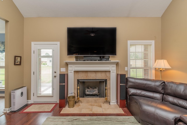 821 Wickham Dr, Graniteville, SC 29829 - living room featuring wood finished floors, a tiled fireplace, and baseboards