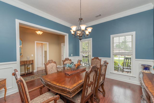 821 Wickham Dr, Graniteville, SC 29829 - dining room with a chandelier, a wainscoted wall, crown molding, dark wood-style floors, and a decorative wall