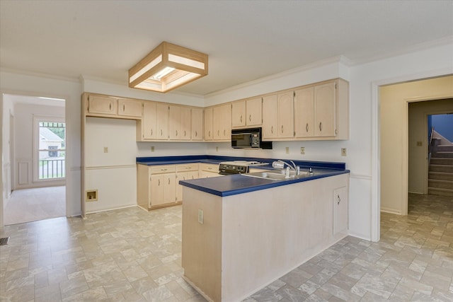 786 Springbrook Ln, Evans, GA 30809 - kitchen featuring black appliances, stone tile flooring, dark countertops, a peninsula, and ornamental molding