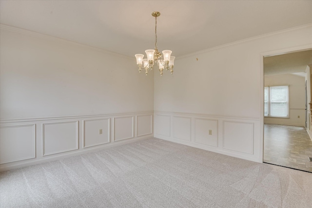 786 Springbrook Ln, Evans, GA 30809 - carpeted empty room featuring a decorative wall, crown molding, a chandelier, and a wainscoted wall
