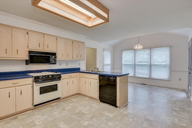 786 Springbrook Ln, Evans, GA 30809 - kitchen with black appliances, dark countertops, a peninsula, lofted ceiling, and cream cabinets