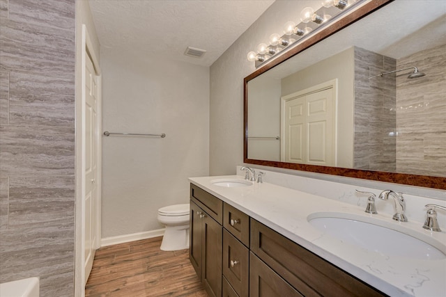 786 Springbrook Ln, Evans, GA 30809 - full bath featuring double vanity, wood finished floors, a shower, and a textured ceiling
