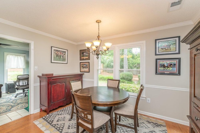 345 Old Salem Way, Martinez, GA 30907 - dining area with a chandelier, crown molding, and light wood-type flooring