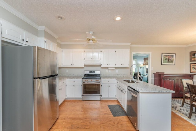 345 Old Salem Way, Martinez, GA 30907 - kitchen featuring appliances with stainless steel finishes, a peninsula, crown molding, under cabinet range hood, and white cabinets