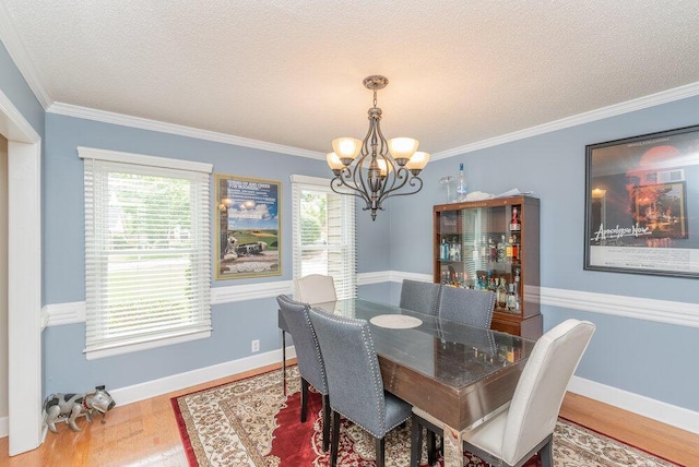 345 Old Salem Way, Martinez, GA 30907 - dining space featuring a chandelier, wood finished floors, ornamental molding, and a textured ceiling