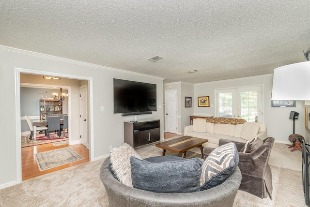 345 Old Salem Way, Martinez, GA 30907 - carpeted living area with ornamental molding, a chandelier, and a textured ceiling