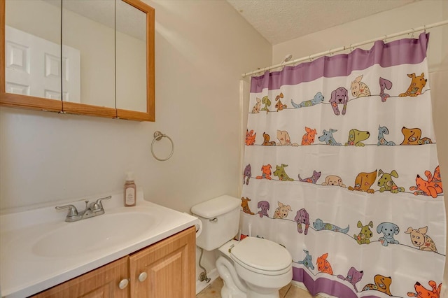 bathroom featuring vanity, curtained shower, a textured ceiling, and toilet