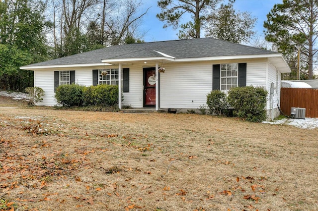 single story home with central AC and a front lawn