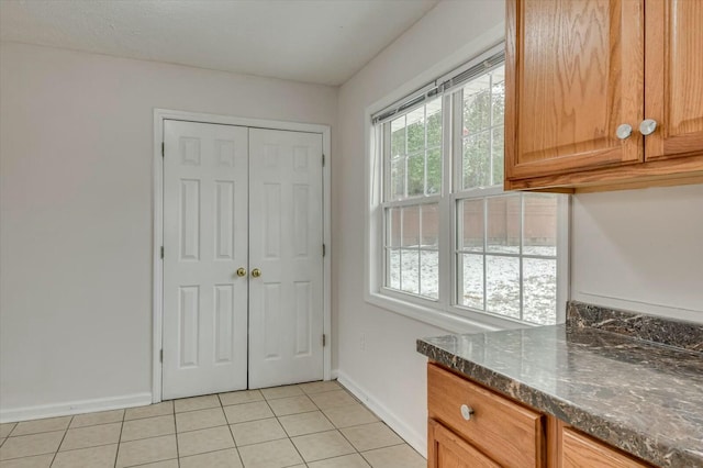 entryway with light tile patterned floors