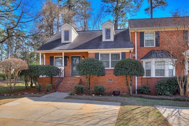 view of front of house with brick siding