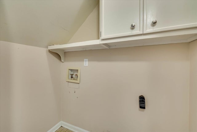 laundry area featuring cabinet space, hookup for a washing machine, and baseboards