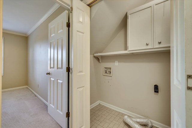 laundry room with light carpet, washer hookup, baseboards, cabinet space, and crown molding