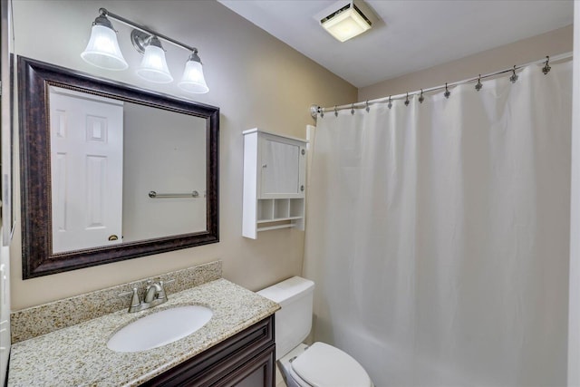 full bathroom featuring visible vents, vanity, and toilet