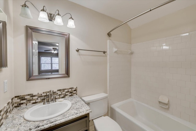 full bathroom featuring tasteful backsplash,  shower combination, vanity, and toilet