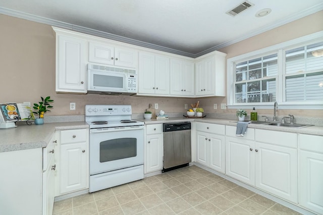 kitchen featuring white cabinetry, white appliances, and sink