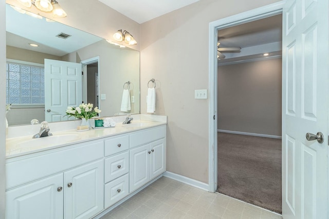 bathroom featuring ceiling fan and vanity