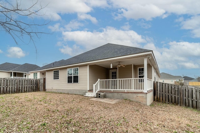 rear view of property with a porch and ceiling fan