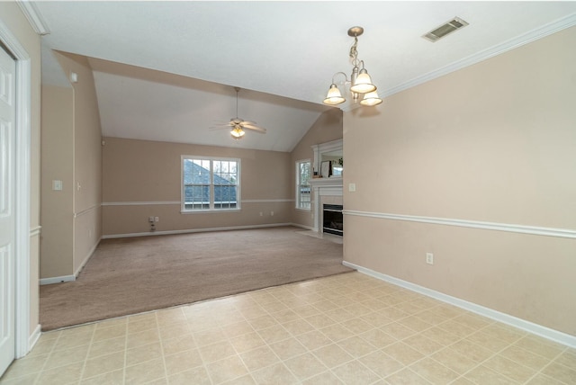 unfurnished living room featuring ceiling fan with notable chandelier, lofted ceiling, and light carpet