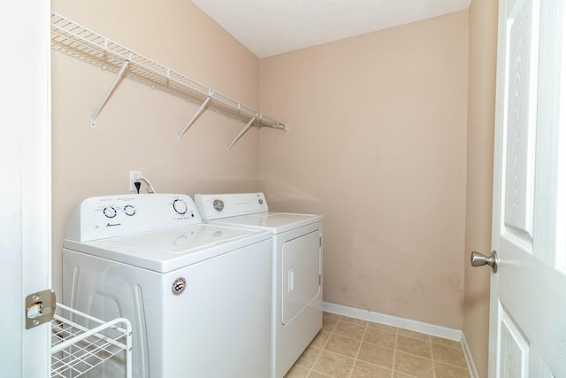 washroom with washing machine and dryer