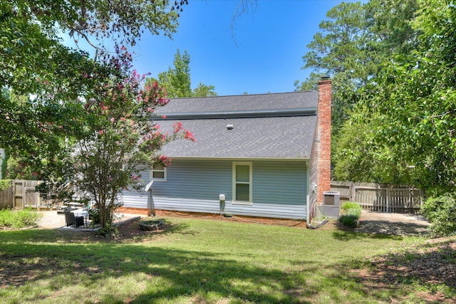 421 Bristol Rd, Martinez, GA 30907 - rear view of property with roof with shingles, a chimney, and a patio area