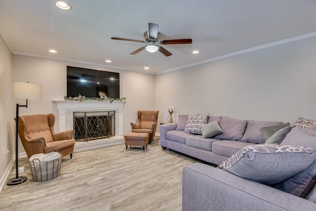 421 Bristol Rd, Martinez, GA 30907 - living area featuring a ceiling fan, recessed lighting, light wood-style flooring, a fireplace, and ornamental molding
