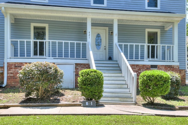 421 Bristol Rd, Martinez, GA 30907 - property entrance with a porch and brick siding