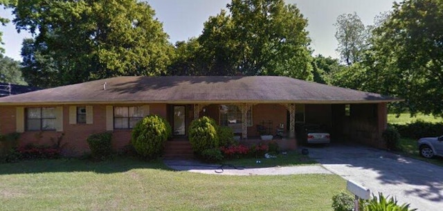 single story home featuring a front yard and a carport