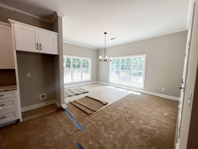 5015 Charnwood Forest Cir, Aiken, SC 29803 - unfurnished dining area with ornamental molding, a chandelier, and baseboards