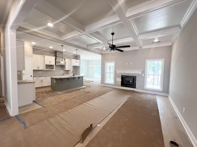5015 Charnwood Forest Cir, Aiken, SC 29803 - living area featuring coffered ceiling, baseboards, a ceiling fan, a fireplace, and beam ceiling