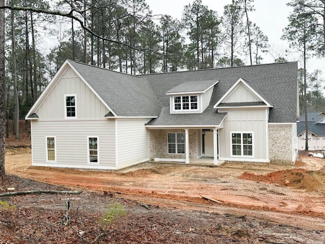 5015 Charnwood Forest Cir, Aiken, SC 29803 - modern farmhouse style home featuring a shingled roof, a porch, and board and batten siding
