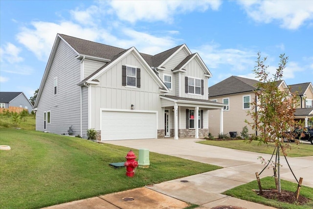 craftsman house with a garage and a front lawn