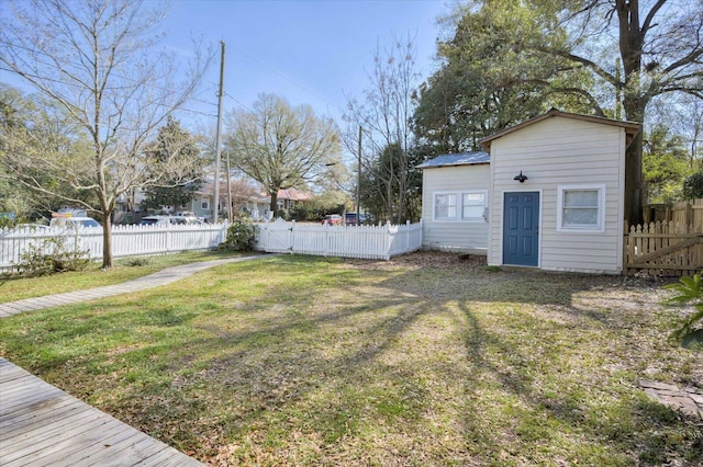 view of yard with an outbuilding and fence private yard