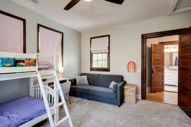 carpeted bedroom featuring ceiling fan