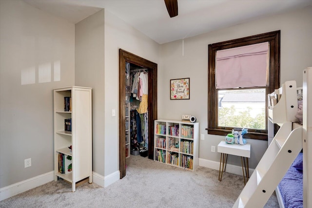 bedroom with baseboards, carpet floors, and ceiling fan