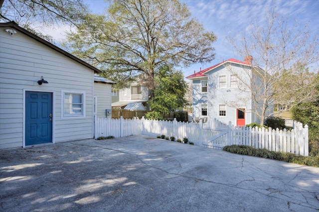 view of home's exterior featuring fence