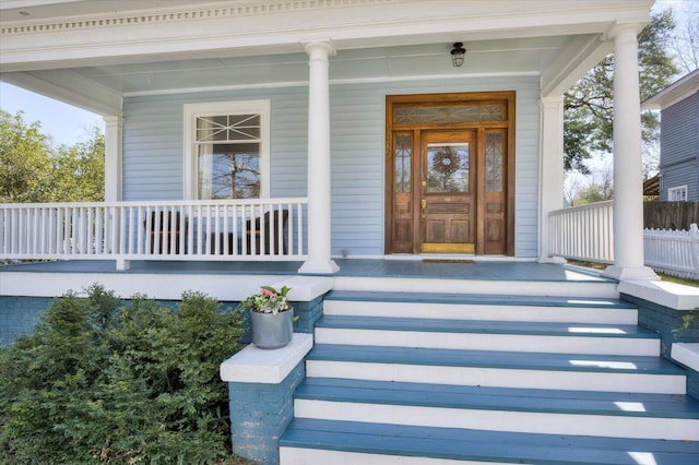 entrance to property featuring covered porch