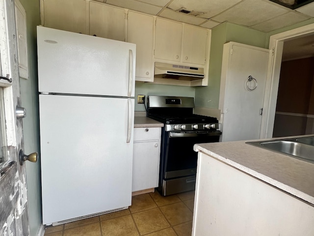 801 Monte Sano Ave, Augusta, GA 30904 - kitchen with freestanding refrigerator, stainless steel range with gas cooktop, under cabinet range hood, and light countertops