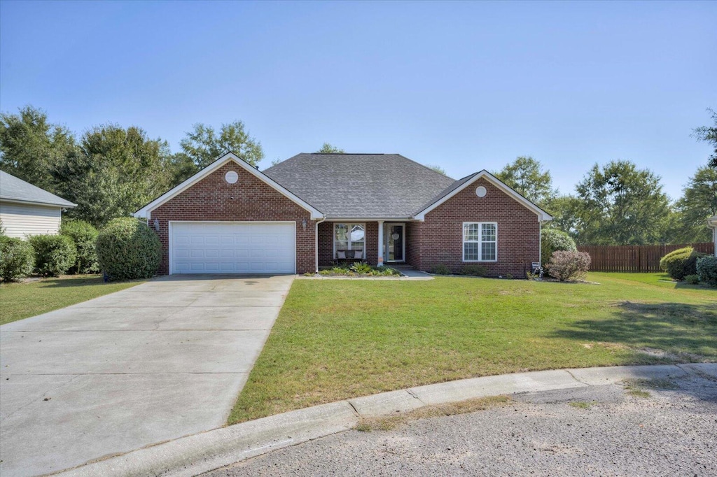 ranch-style house with a front lawn and a garage