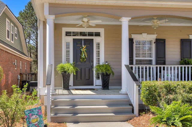 entrance to property with covered porch and ceiling fan