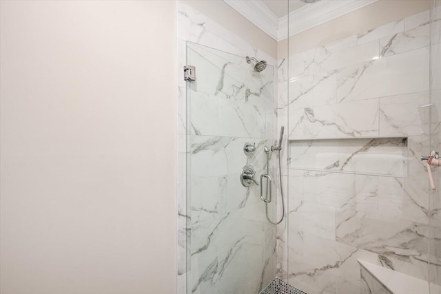 full bath featuring crown molding and a marble finish shower