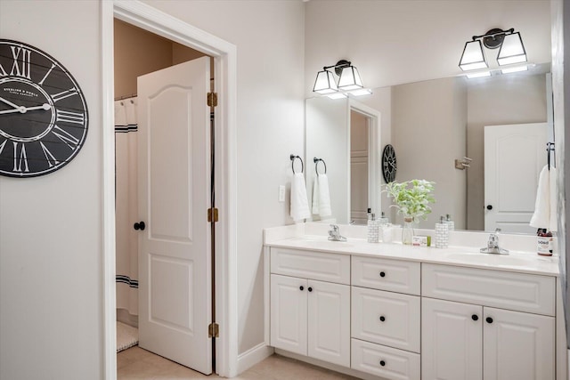 909 Nerium Trl, Evans, GA 30809 - bathroom with a sink, baseboards, tile patterned flooring, and double vanity